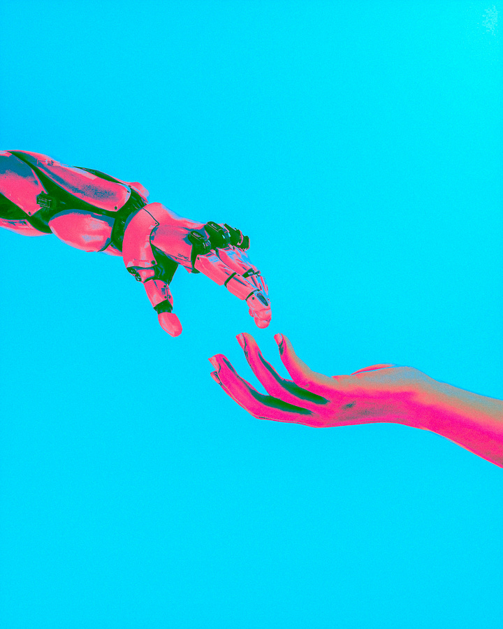 Machine and human hand, photo by Cash Macanaya via Unsplash. Screenshot of an AI response I got a few weeks ago.