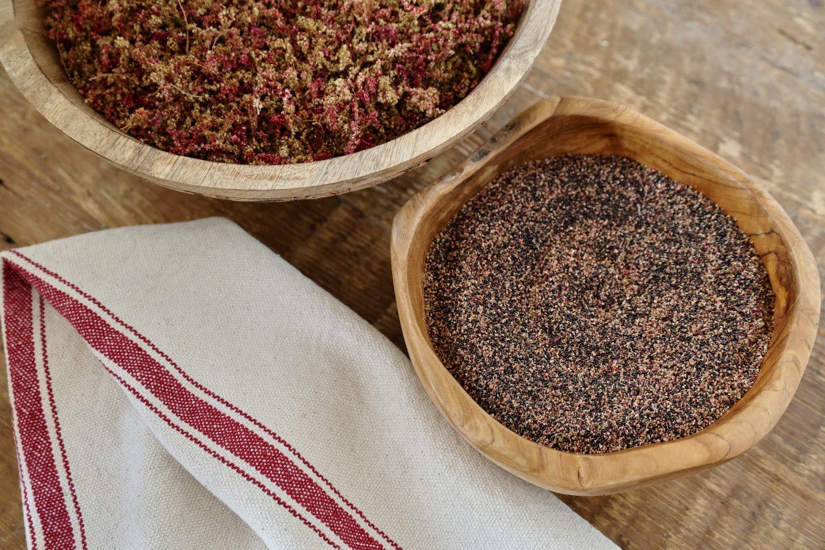 amaranth seeds, flowers, and a kitchen towel amaranth seeds, flowers, and a kitchen towel