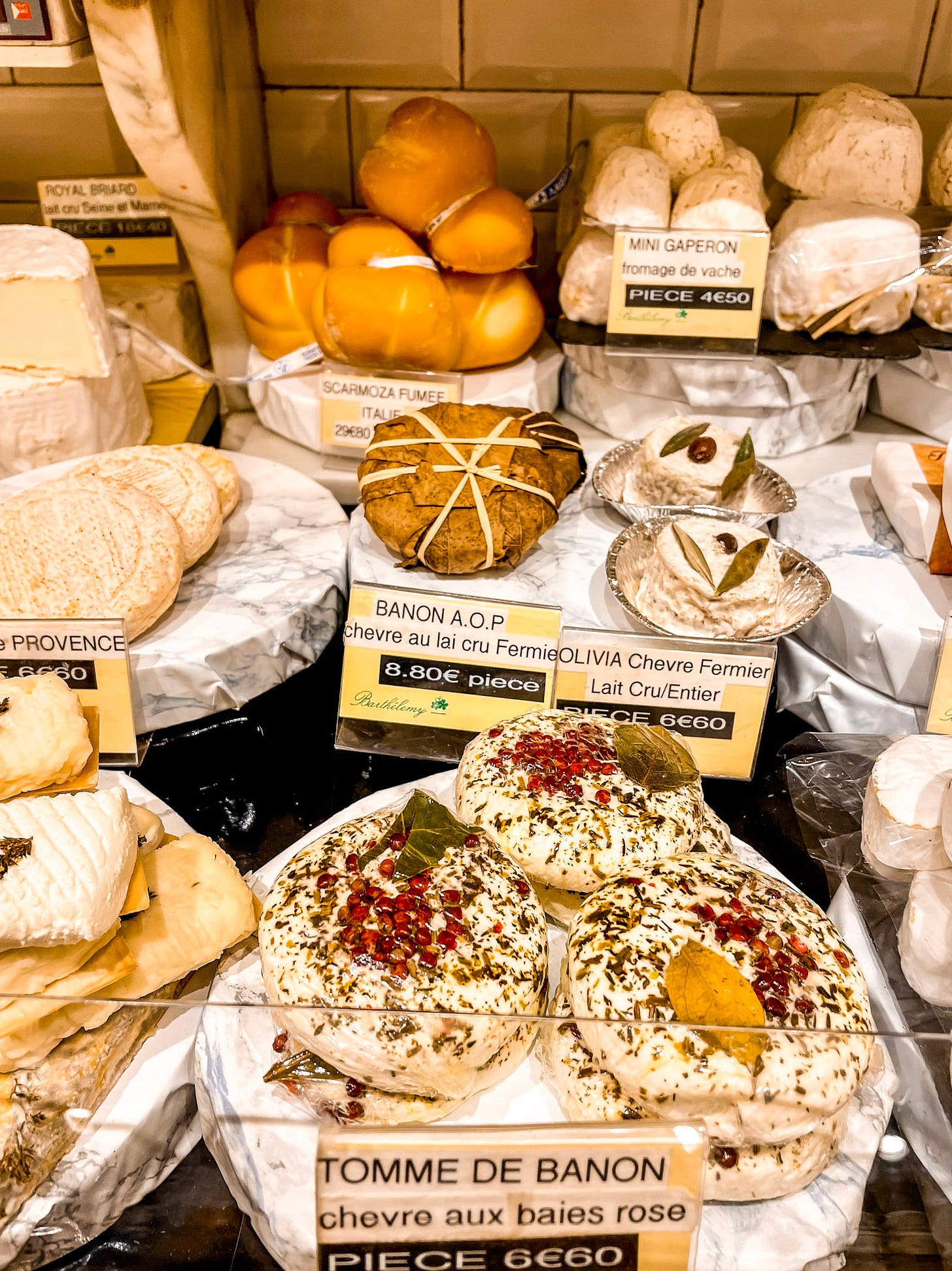 A selection of French cheeses displayed inside Barthélémy, including regional specialties from across France. A selection of French cheeses displayed inside Barthélémy, including regional specialties from across France.