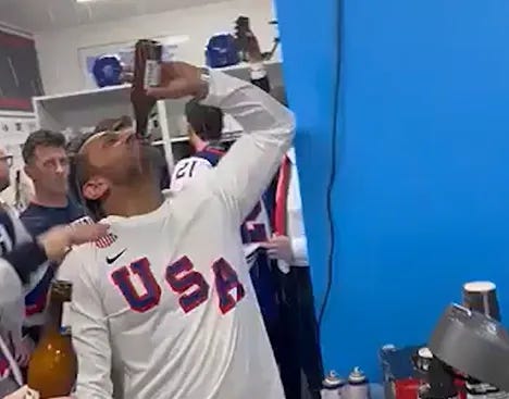 Kash Patel celebrating with the US men's hockey team at the Winter Olympics