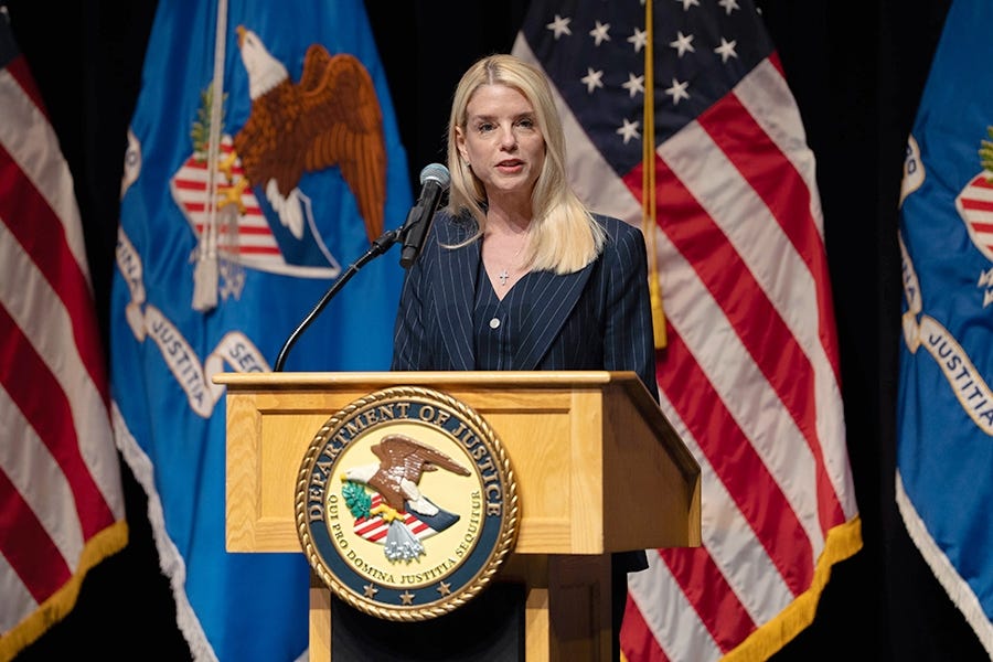 Attorney General Pamela Bondi delivers remarks from a podium at the Museum of the Bible. She is joined by members of the Religious Liberty Commission.