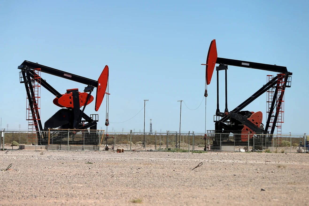Oil pump jacks at the Vaca Muerta shale oil and gas deposit in the Patagonian province of Neuquen, Argentina