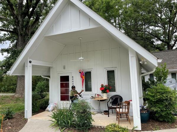 In this photo provided by The Rev. Lisa G. Fishbeck, Nathaniel “Pee Wee” Lee sits outside his home in Chapel Hill, N.C., on May 23, 2022. Fischbeck led the Episcopal Church of the Advocate when it added three one-bedroom units on its 15-acre campus. The first residents, including Lee, moved into them in June 2019. Before that Lee, 78, had spent years sleeping in alleys, cardboard shelters and cars after medical issues ended his bricklaying career. (The Rev. Lisa G. Fishbeck via AP) In this photo provided by The Rev. Lisa G. Fishbeck, Nathaniel “Pee Wee” Lee sits outside his home in Chapel Hill, N.C., on May 23, 2022. Fischbeck led the Episcopal Church of the Advocate when it added three one-bedroom units on its 15-acre campus. The first residents, including Lee, moved into them in June 2019. Before that Lee, 78, had spent years sleeping in alleys, cardboard shelters and cars after medical issues ended his bricklaying career. (The Rev. Lisa G. Fishbeck via AP)