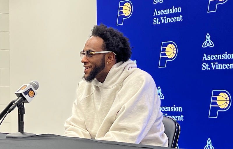 Pacers wing Oshae Brissett talks with reporters after a game.