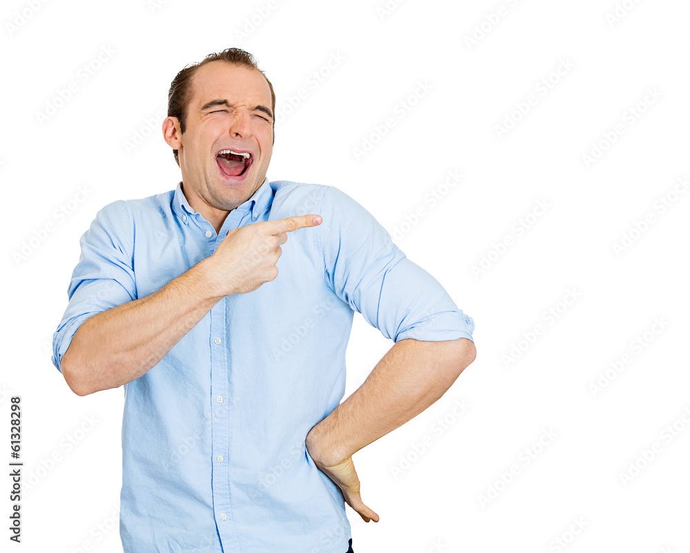 Happy young man laughing, pointing at someone Stock Photo | Adobe Stock