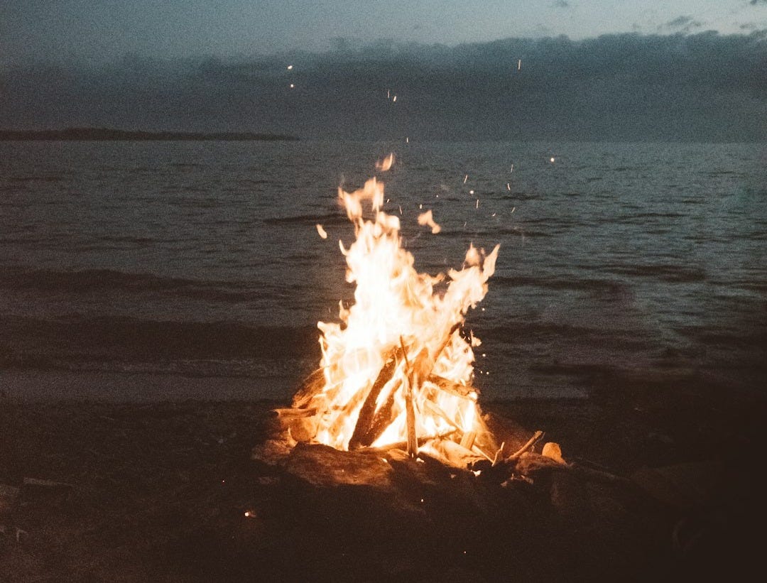 bonfire near seashore during nighttime bonfire near seashore during nighttime