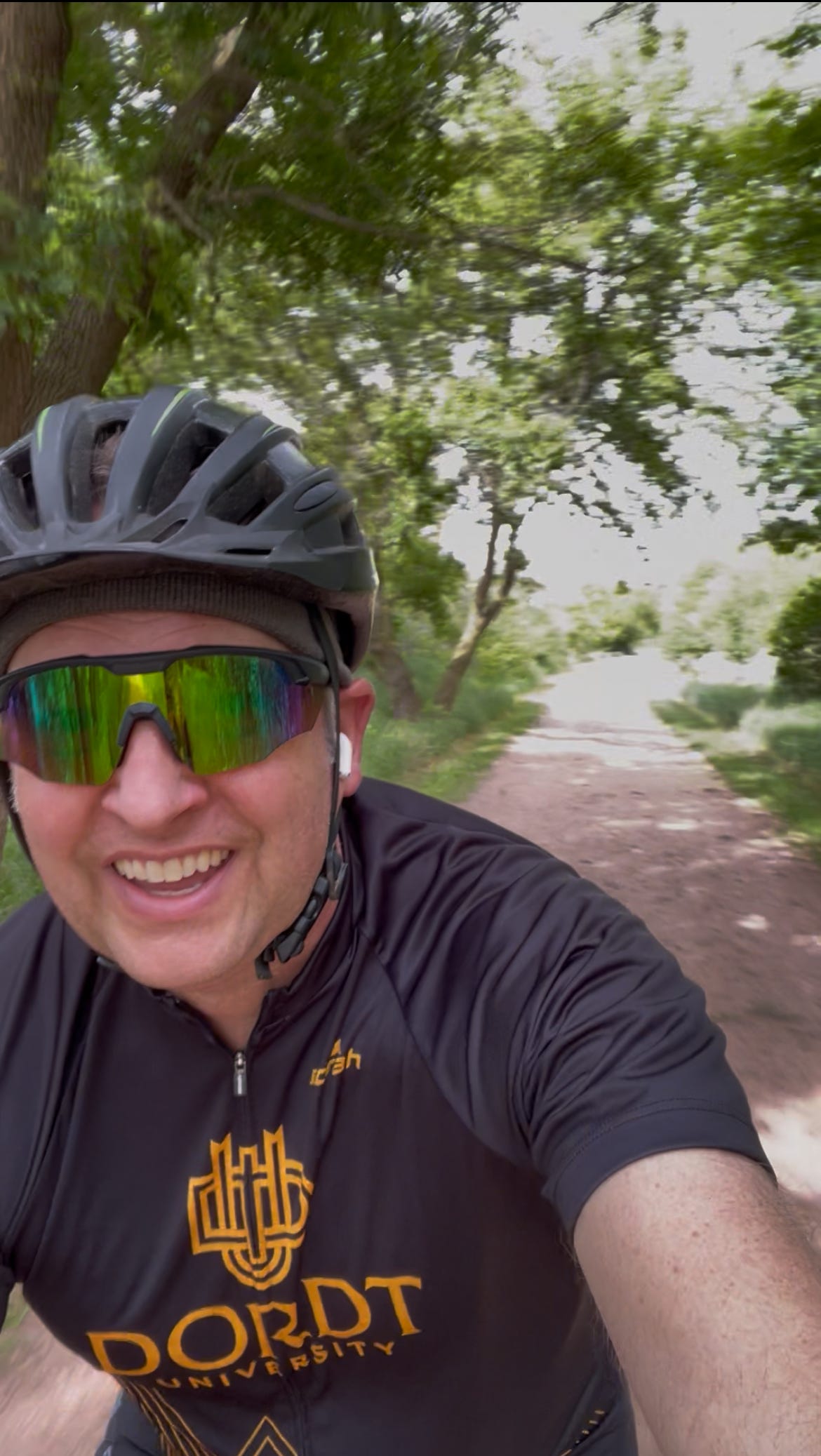 Dr. Dave, biking on a trail