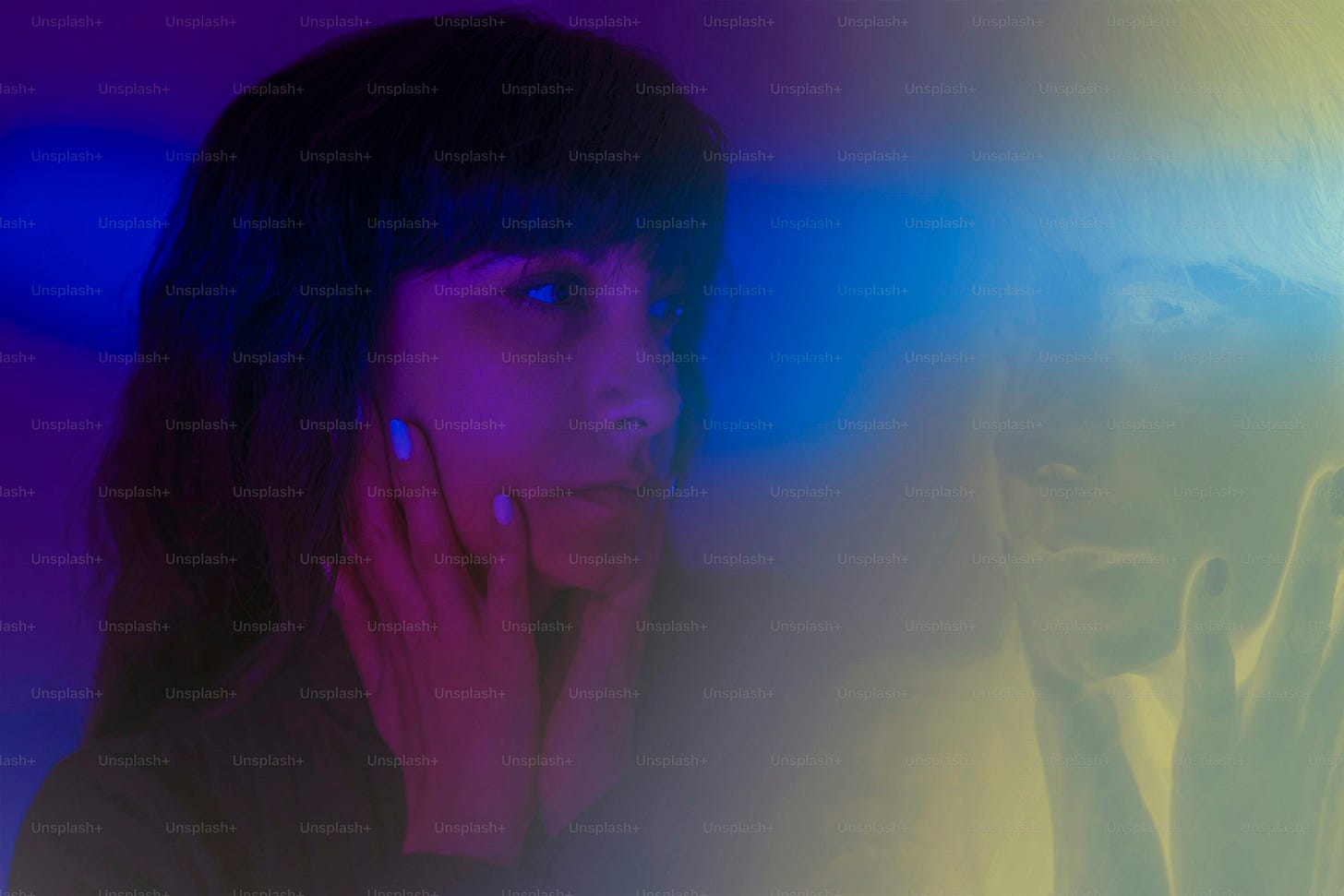 A woman is surrounded by colorful light.