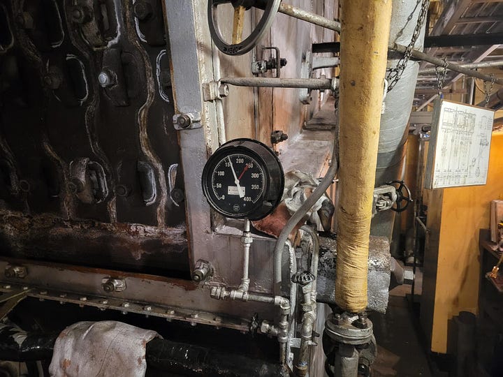The draft fan, the throttle wheel, the chief's desk and a pressure gauge.
