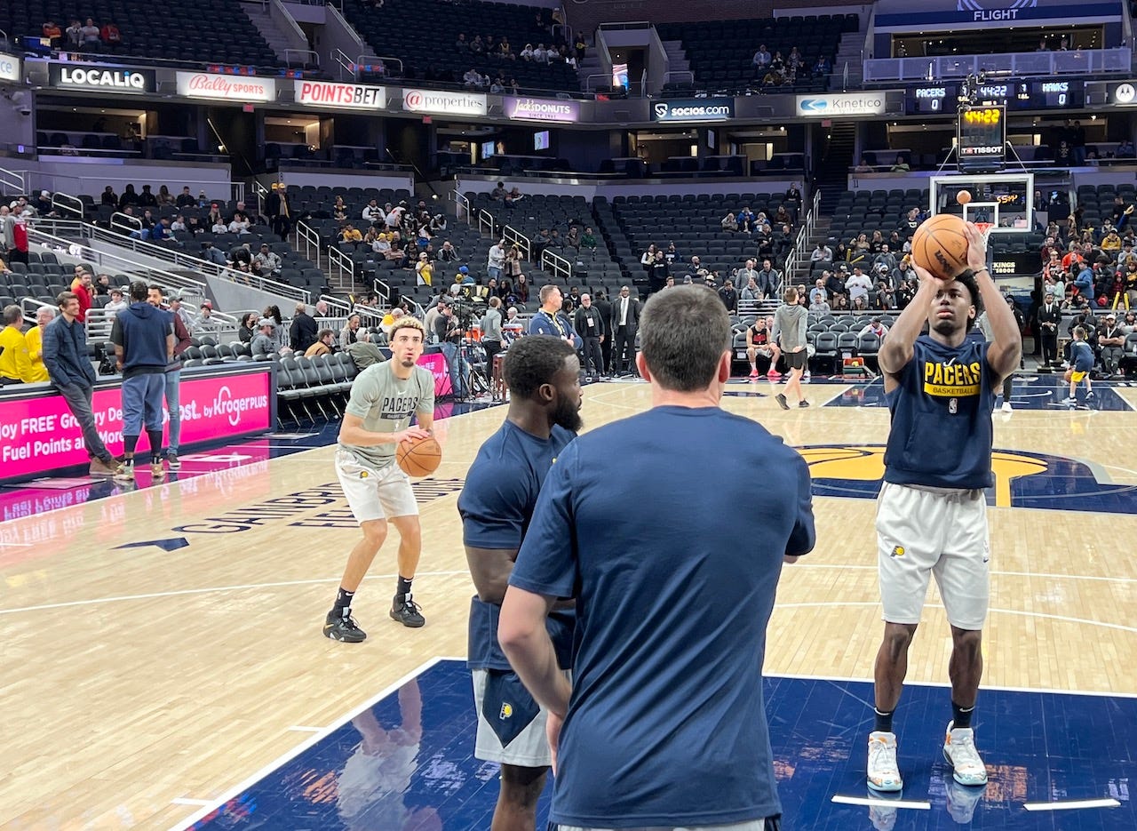 Chris Duarte (left) and Aaron Nesmith warm up prior to a game.