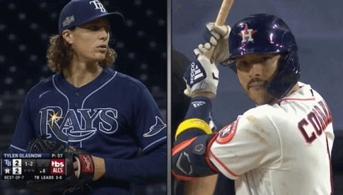 two baseball players one from the rays and one from the astros are standing next to each other two baseball players one from the rays and one from the astros are standing next to each other