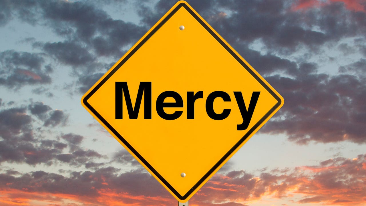 A yellow sign that says, "Mercy." A yellow sign that says, "Mercy."