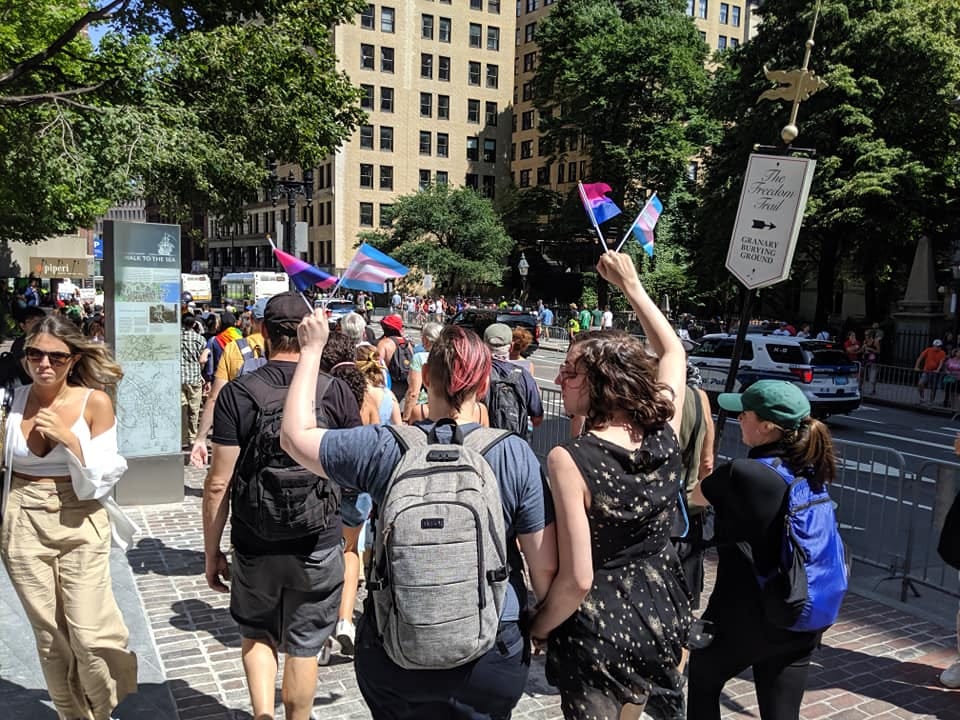 Image may contain: 1 person, standing, crowd, tree and outdoor Image may contain: 1 person, standing, crowd, tree and outdoor