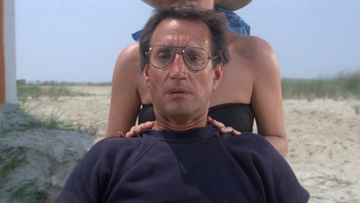 Scene from the movie Jaws in which camera zooms in on Roy Scheider as he recognizes a shark fin in the water.