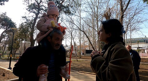 Leyla, 4, a Ganja massacre survivor and her former home. 