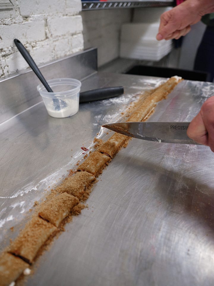 Cutting the cookies, placing them on a sheet pan