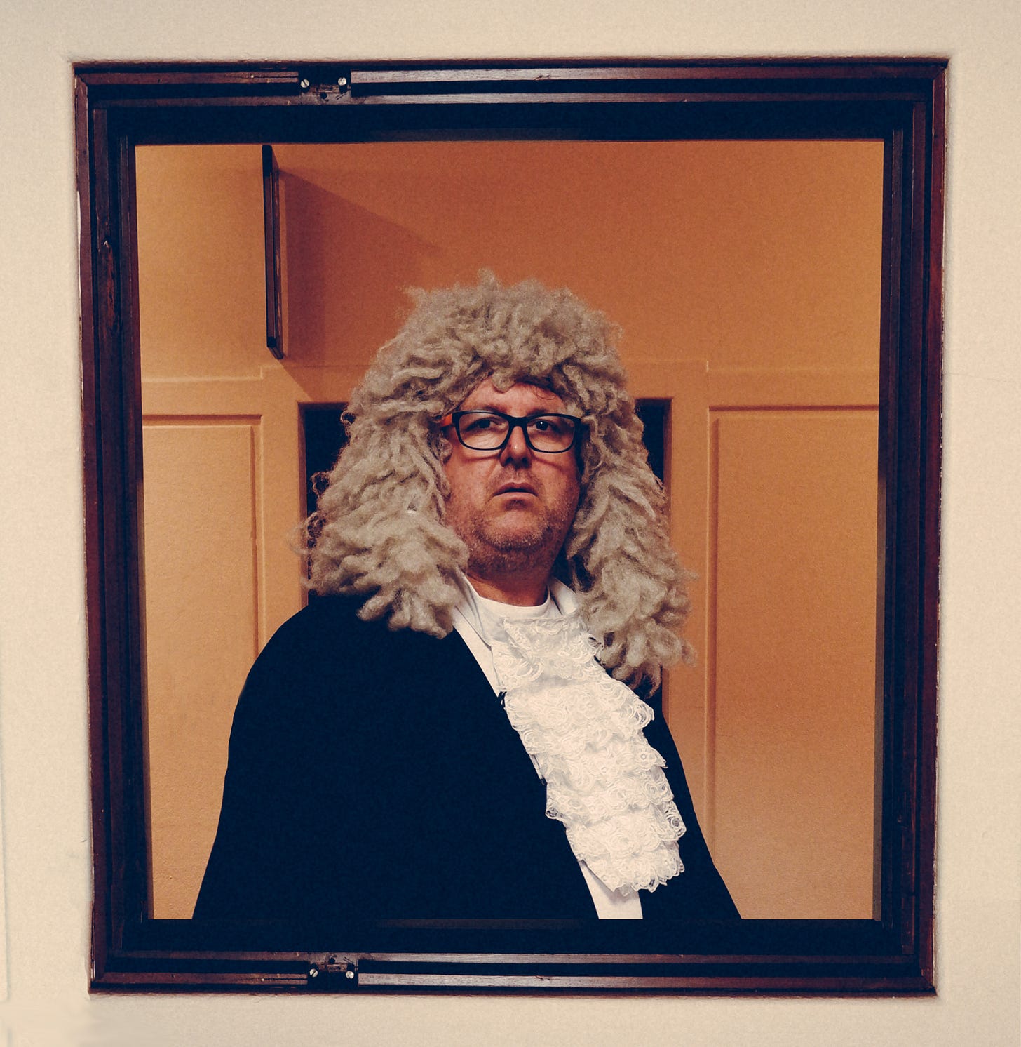 Me in judge wig and robe, in an old looking room. 