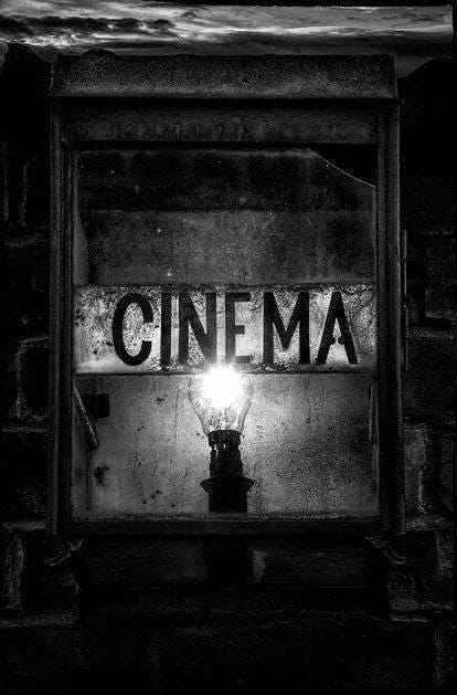 May be a black-and-white image of text that says 'CINEMA'