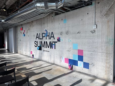 AlphaSummit 2025  — main stage, branded motion system and opening film.