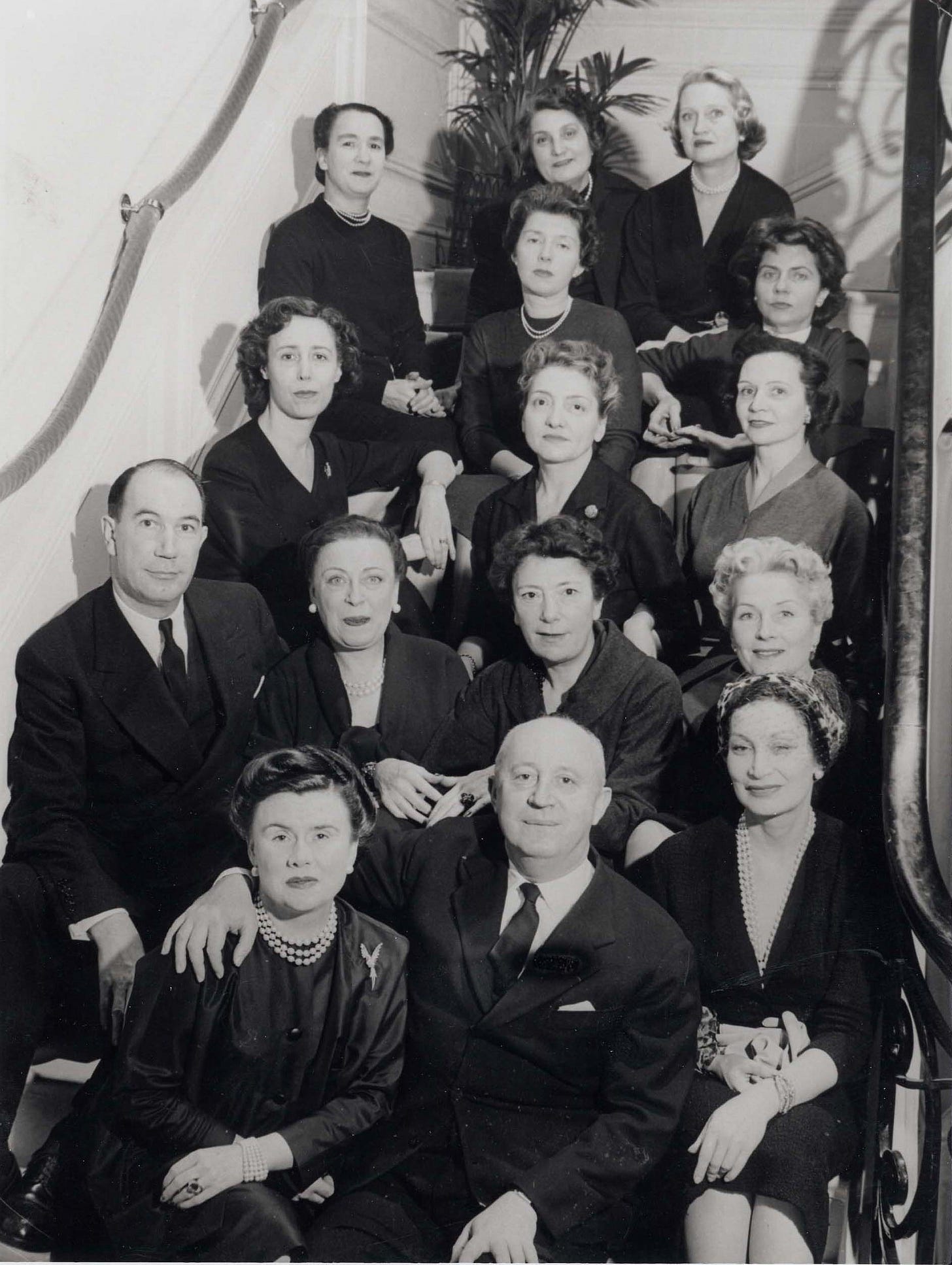 LA MAISON DIOR – HERO La Maison Dior: Surrounded by his dream team, Dior was seated between Marguerite Carré (left) and Mitzah Bricard. Image courtesy Dior