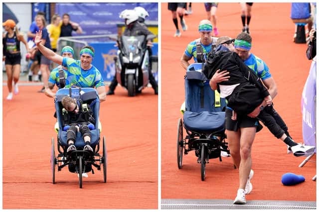 Kevin Sinfield carries his friend and teammate Rob Burrow across the finish line at Headingley Stadium in Leeds. Picture: Danny Lawson/PA Wire