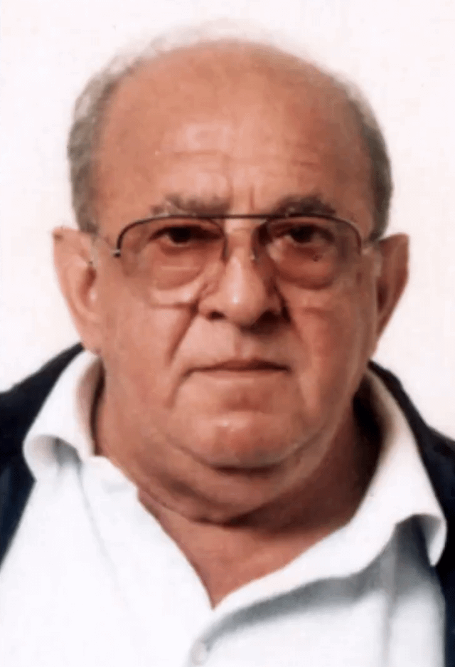 A person wearing glasses and a white shirt

Description automatically generated