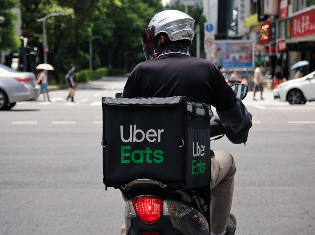 man in black jacket riding motorcycle on road during daytime