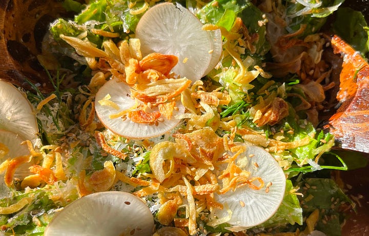Fried onions on a salad and in a jar