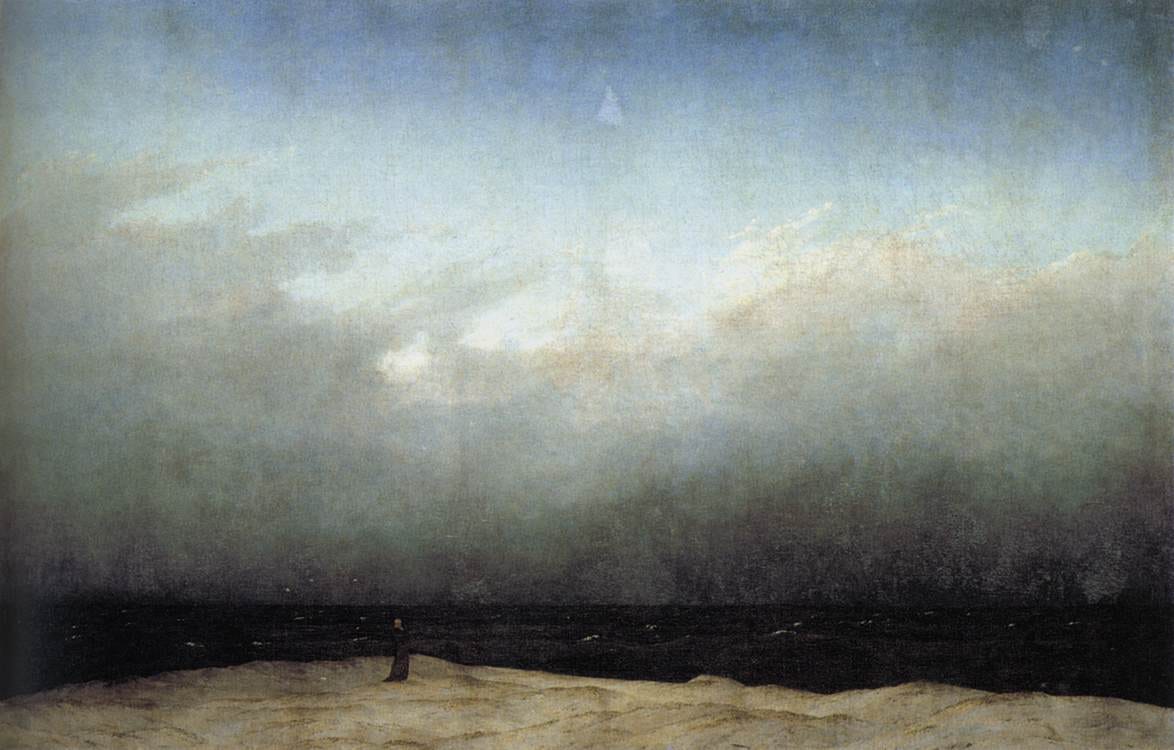 A tiny lone monk stands on a bare shore before a vast empty sea and enormous sky A tiny lone monk stands on a bare shore before a vast empty sea and enormous sky