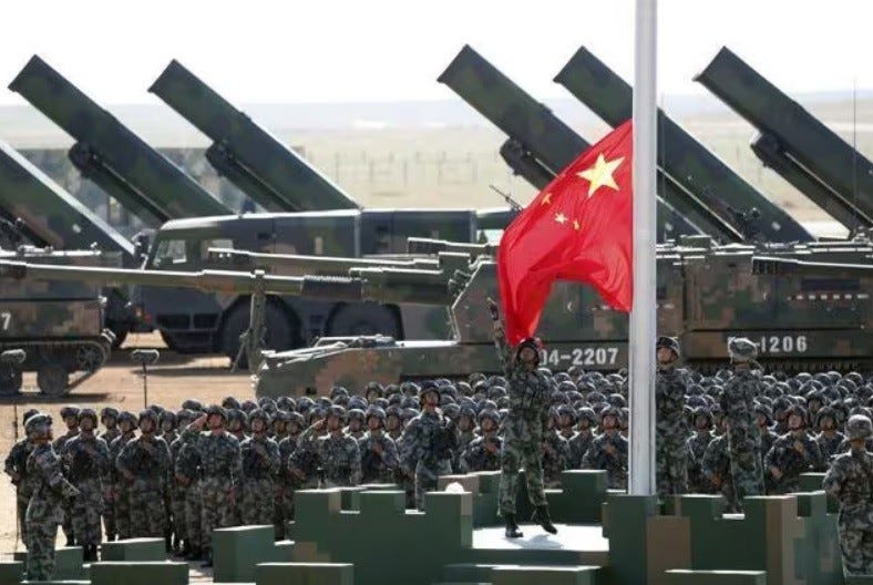 Chines troops on at flag raising ceremony. 
