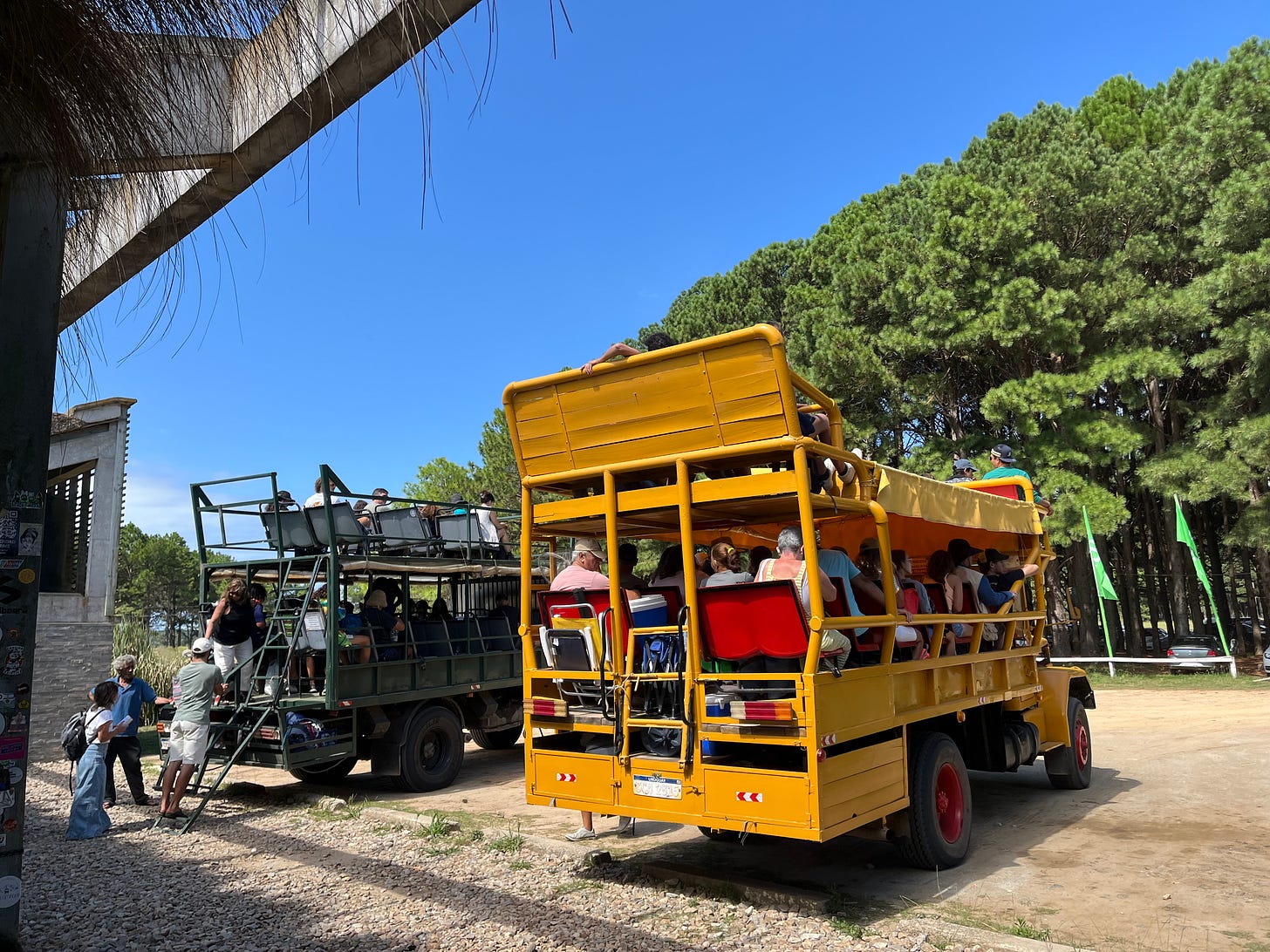 two large jeeps filled with people in cabo polonio national park