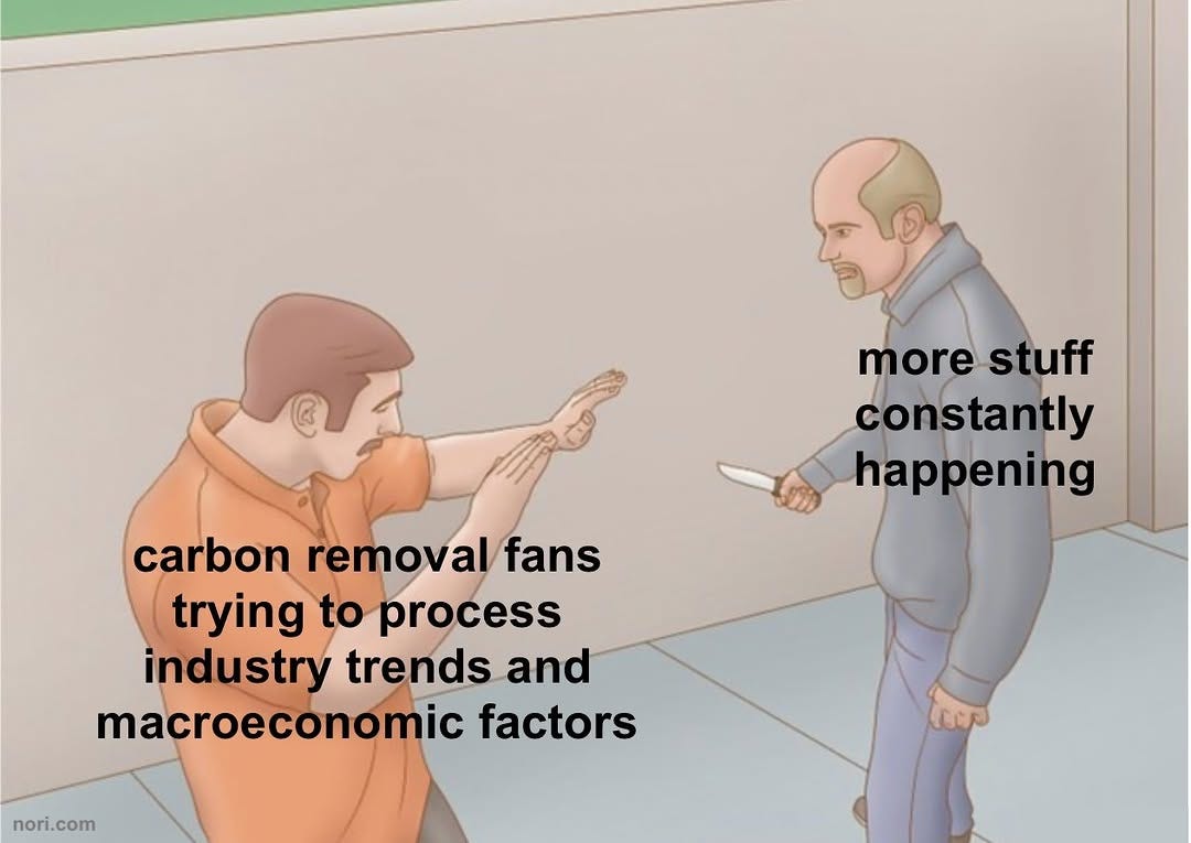 Illustration of a man holding up his hands to stop another man approaching with a knife. The first is labelled "carbon removal fans trying to process industry trends and macroeconomic factors"; the second "more stuff constantly happening".