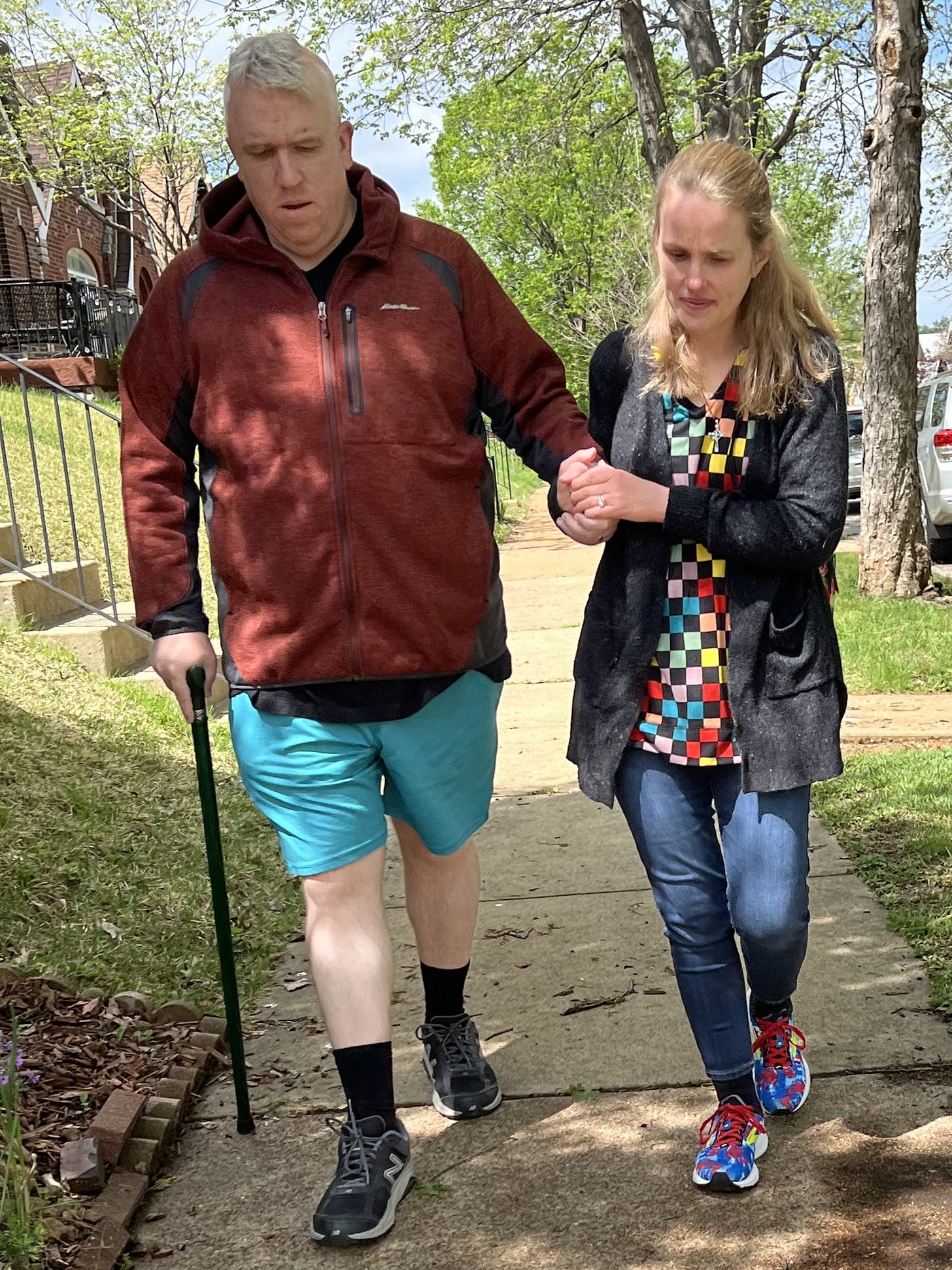 Man walking through a quiet neighborhood during recovery from brain surgery, reflecting healing, preparation, and forward movement.
