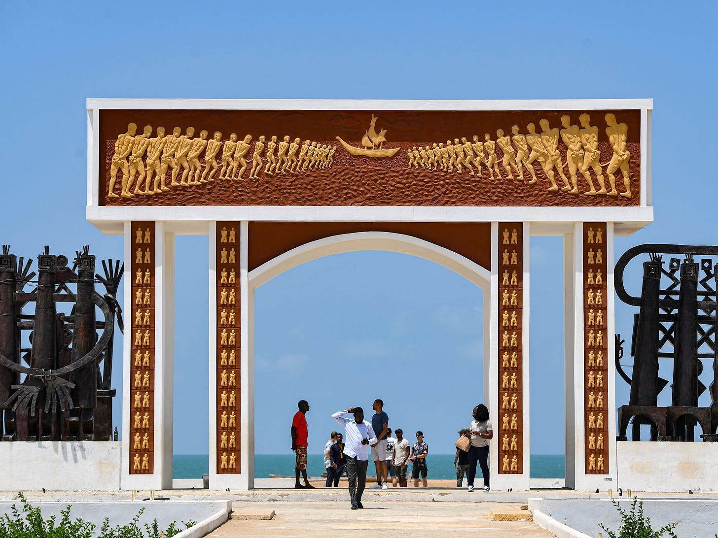 ​Some visitors at the Door of No Return in Ouidah, Benin.