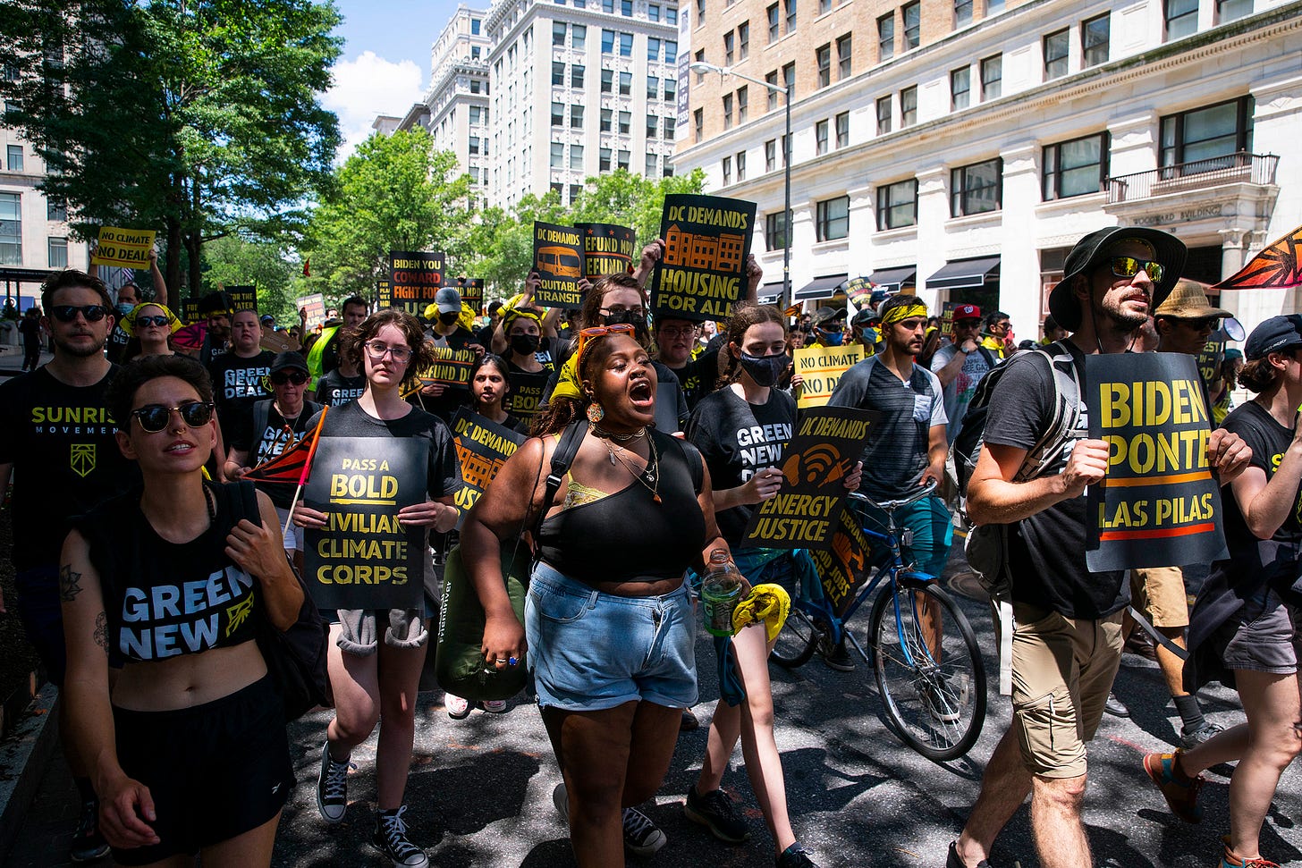 Members of Sunrise Movement march near the  White House as part of a demonstration against the Biden administration on June 28. | Sarah Silbiger / POLITICO