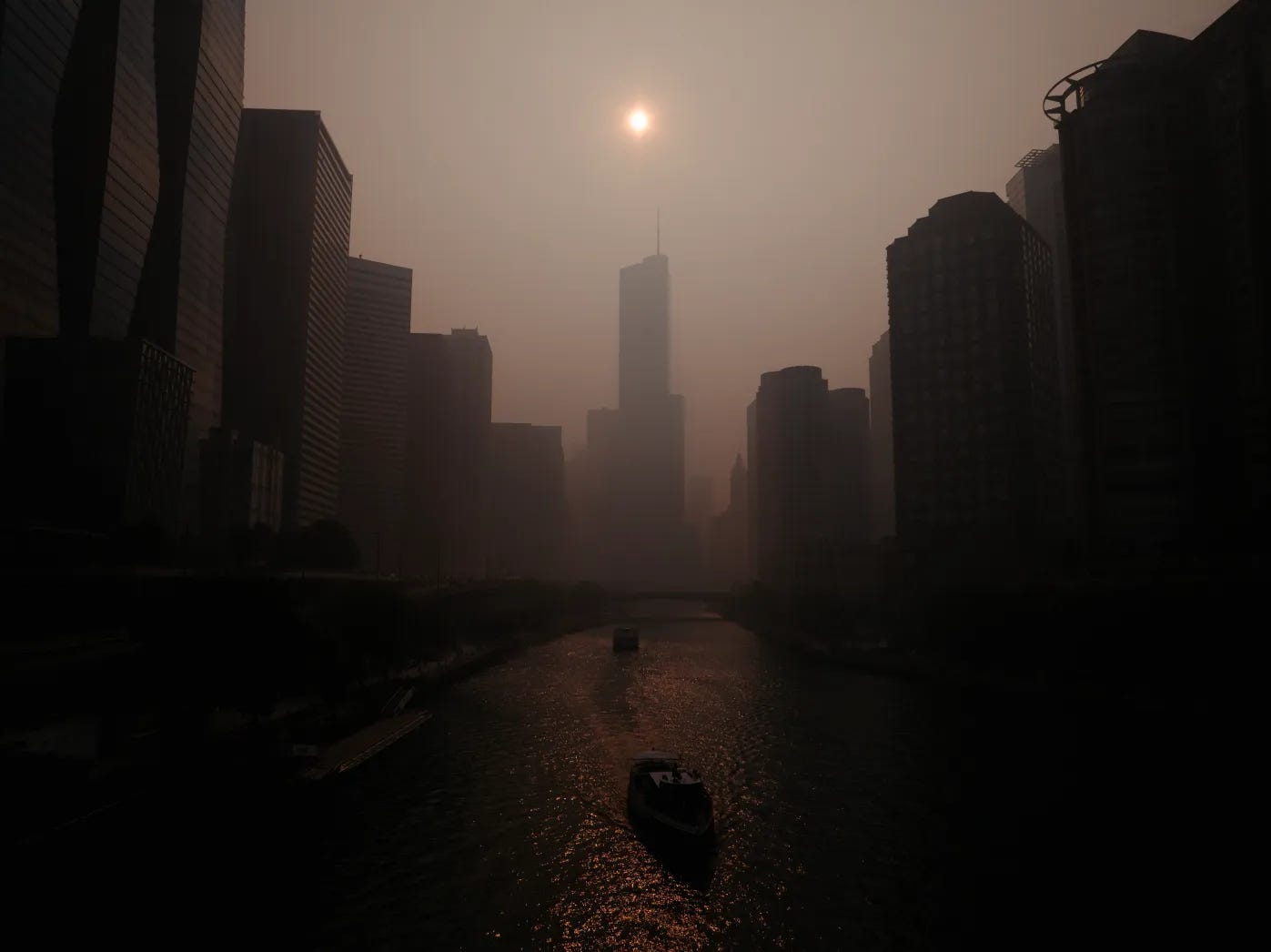 The sun over the Chicago skyline, behind a veil of wildfire smoke. The sun over the Chicago skyline, behind a veil of wildfire smoke.