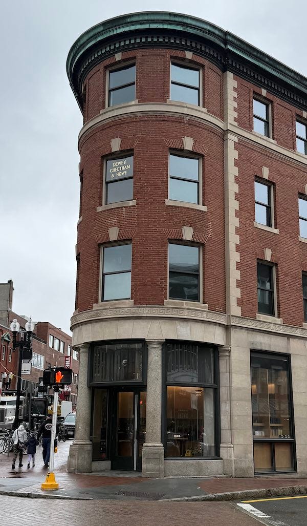 photo of a 4-story brick building.