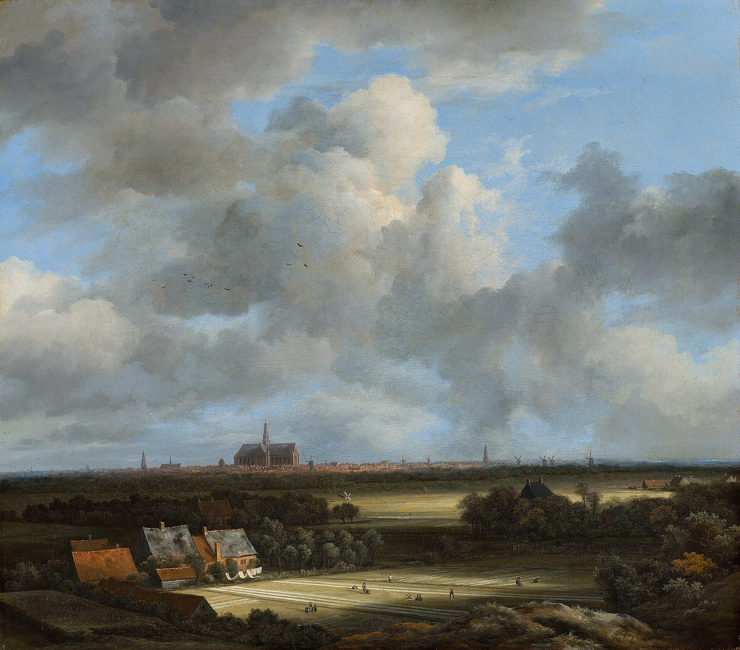A vast cloudy sky above a flat Dutch landscape with linen fields and the church of Haarlem on the horizon A vast cloudy sky above a flat Dutch landscape with linen fields and the church of Haarlem on the horizon