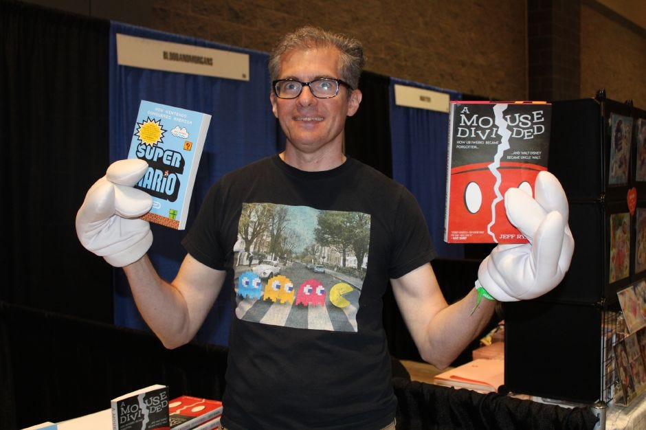 Jeff Ryan, author of “A Mouse Divided” and “Super Mario,” holds up his published books at the RetroWorld Expo at the Hartford Convention Center on Sunday, Aug. 27. 