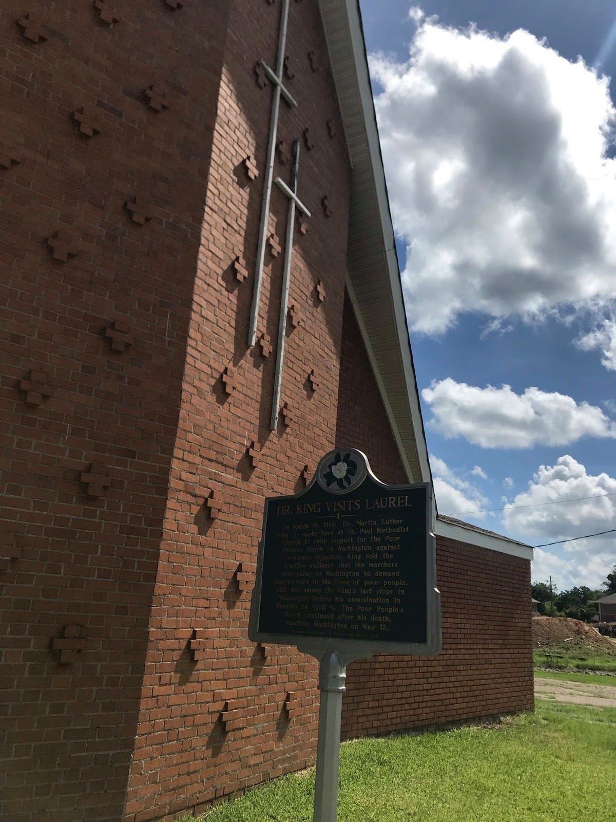 May be an image of outdoors, monument and brick wall