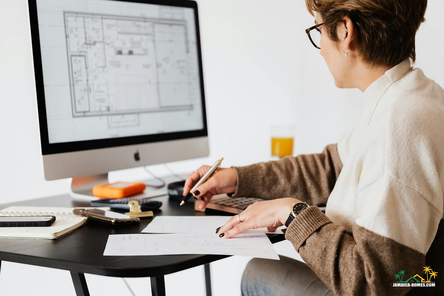 crop estate agent working with computer in office