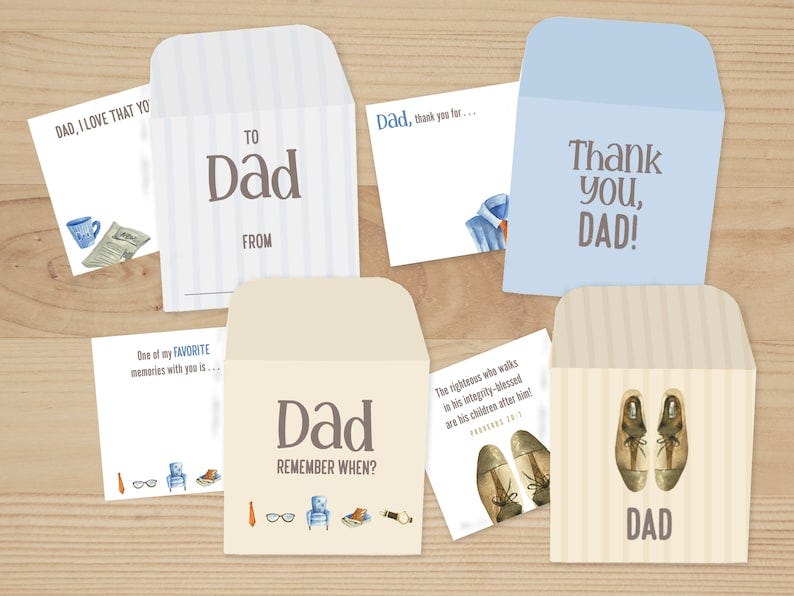 May include: Five blank cards with envelopes for Father's Day. The cards have different designs with illustrations of a cup of coffee and a newspaper, a pair of glasses, a chair, a pair of shoes, and a shirt and tie. The cards have text that says 'Dad, I love that you', 'To Dad From', 'Dad, thank you for...', 'Thank you, Dad!' and 'Dad Remember When?' and 'Dad'. The envelopes are striped in blue and white, and beige and white.
