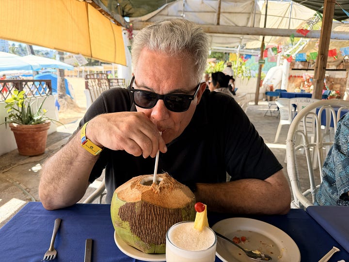 Coconut milk, octopus, seafood crepes, and the view of the beach at La Cabaña in Acapulco