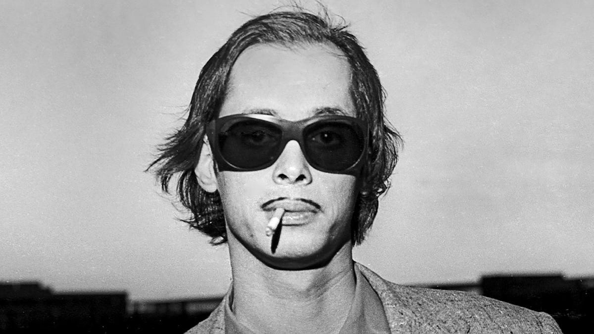 John Waters Talks His Life in Parties, Legendary Muses & That Mustache