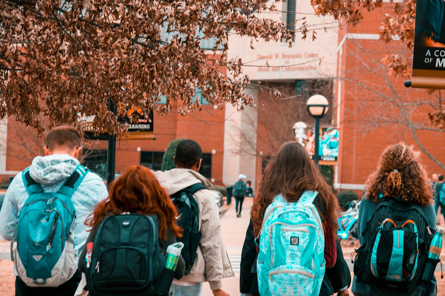 college students wearing backpacks college students wearing backpacks