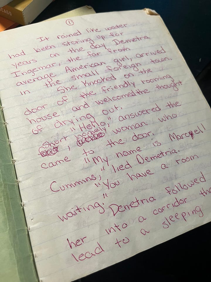 handwritten printed words in maroon ink on brittle wide-ruled paper