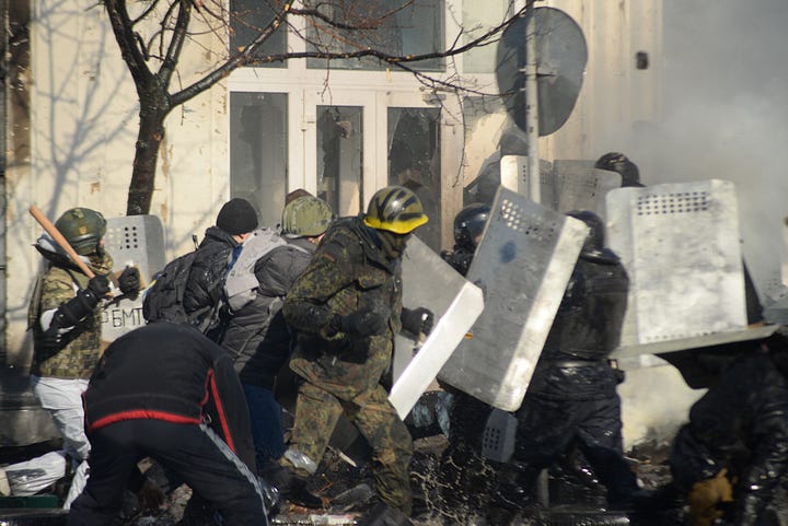 Protestors and government forces face off and clash in Kyiv, February 18, 2014.
