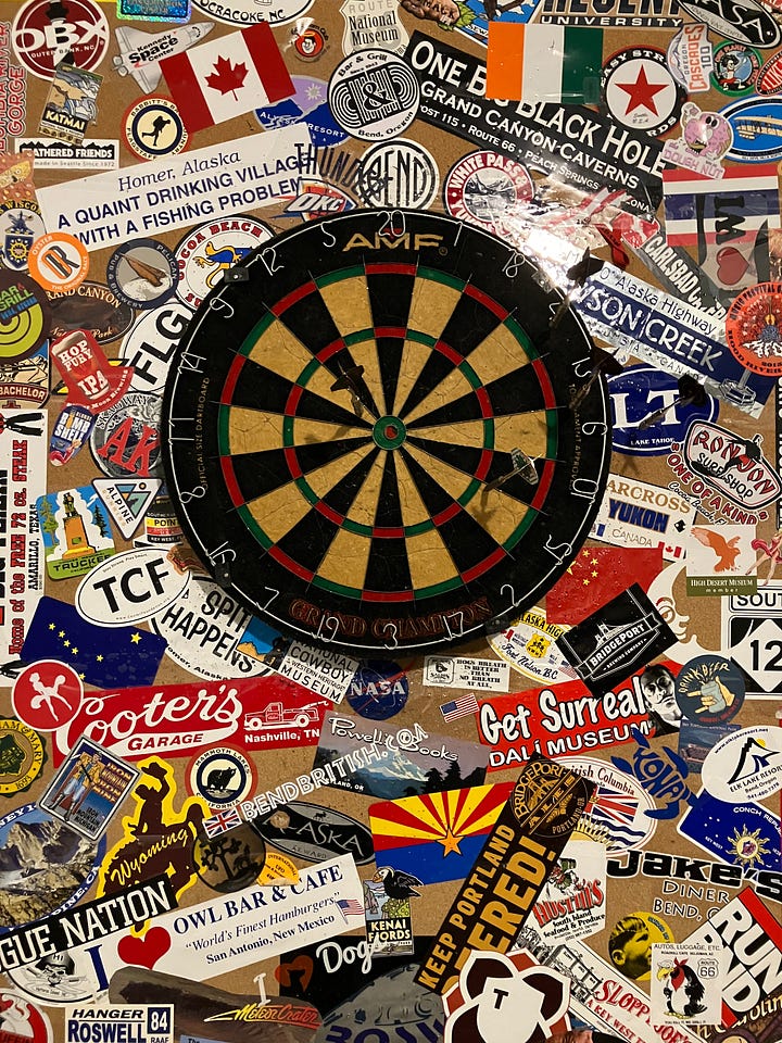 Ping pong, pool, Pac-Man, TV entertainment center, and dart board