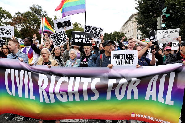 LGBT activists and supporters block the street outside the U.S. Supreme Court in Washington, U.S.