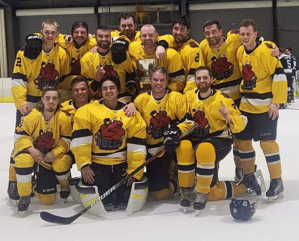 May be an image of 9 people, people playing hockey and text